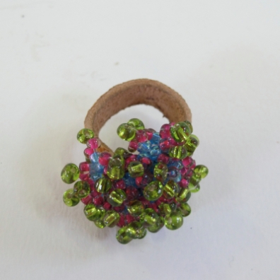 Fluffy Ring: glass beads and leather